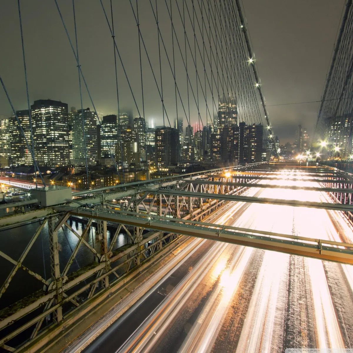 The Brooklyn Bridge at night, looking toward Manhattan